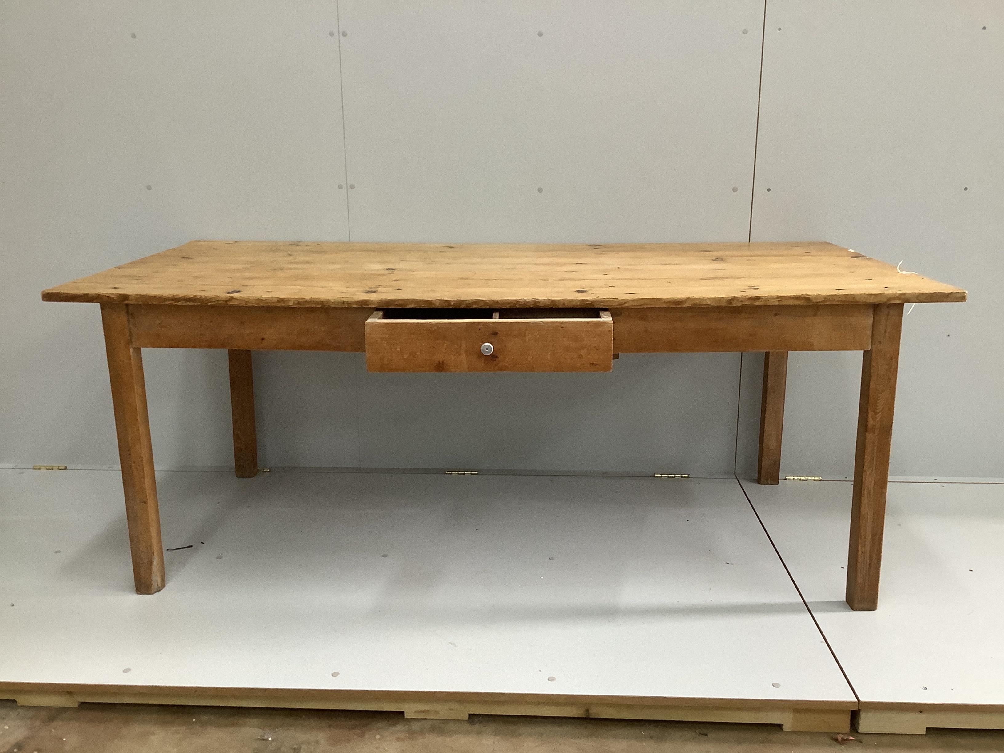 A 19th century French rectangular pine kitchen table, length 192cm, width 90cm, height 74cm